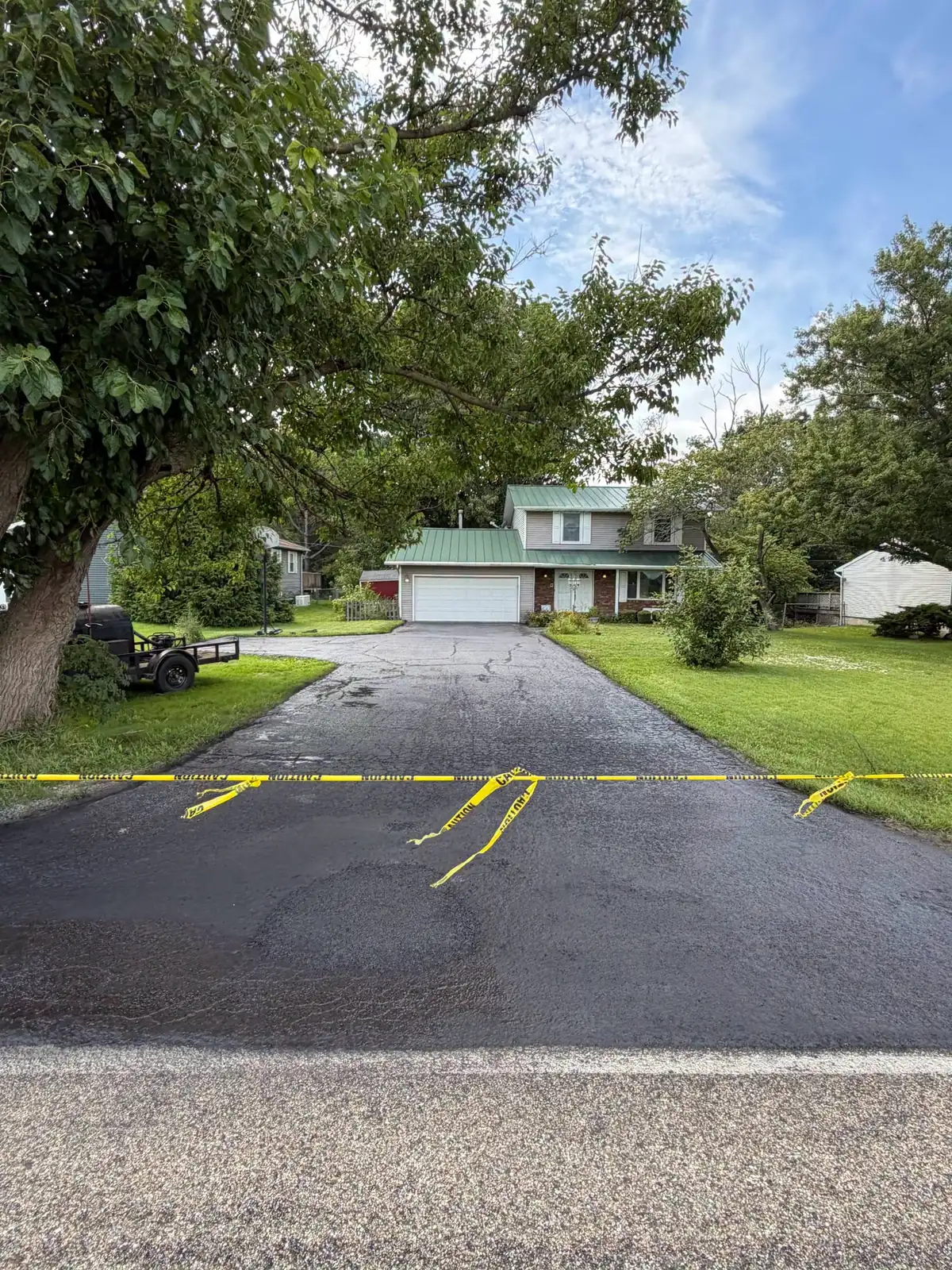 The same apron finished dark and even, taped off while the surface sets.
